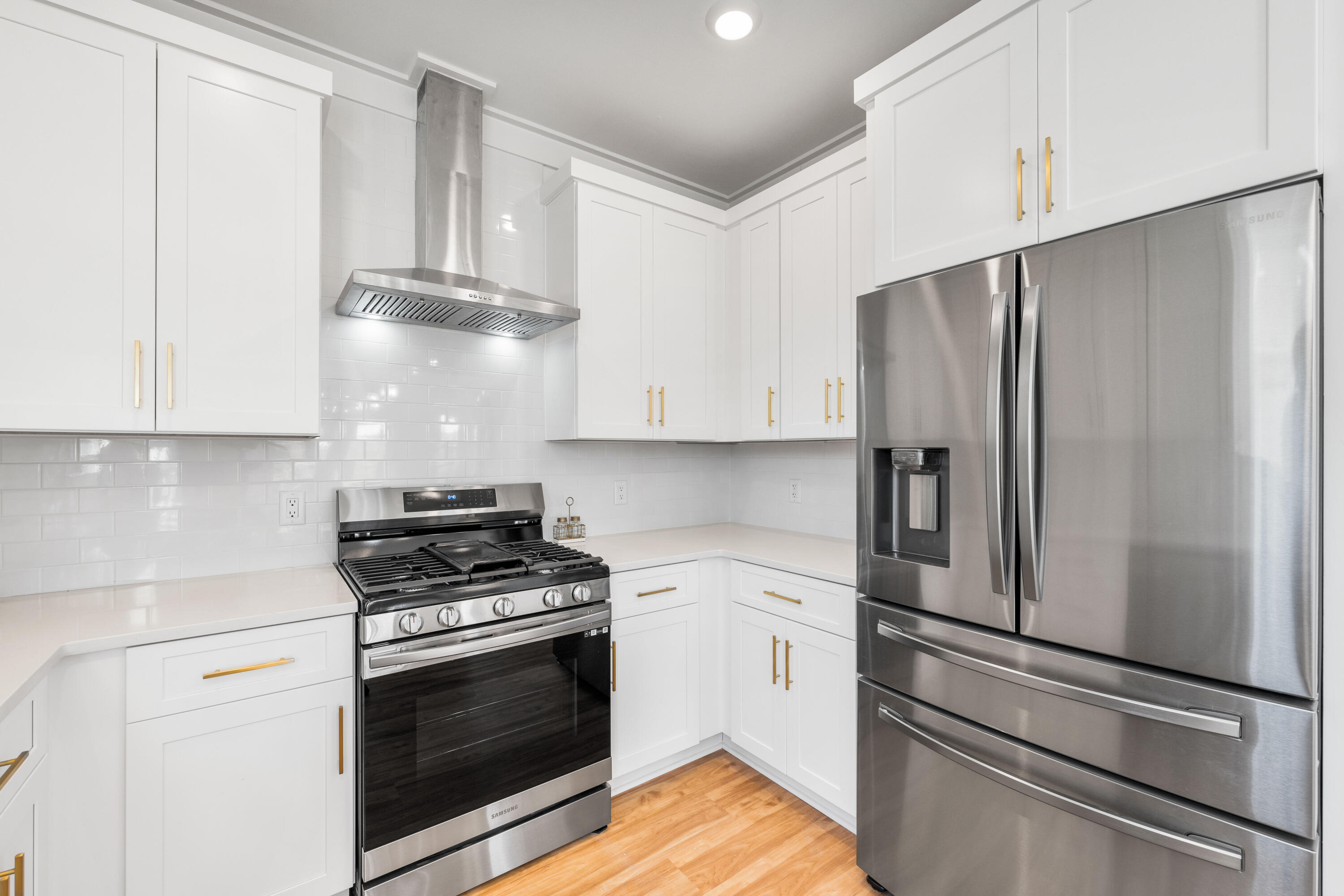 104 Fletcher Way Destin, FL 32541 - Photo 18 of 59 a kitchen with stainless steel appliances a refrigerator stove and sink