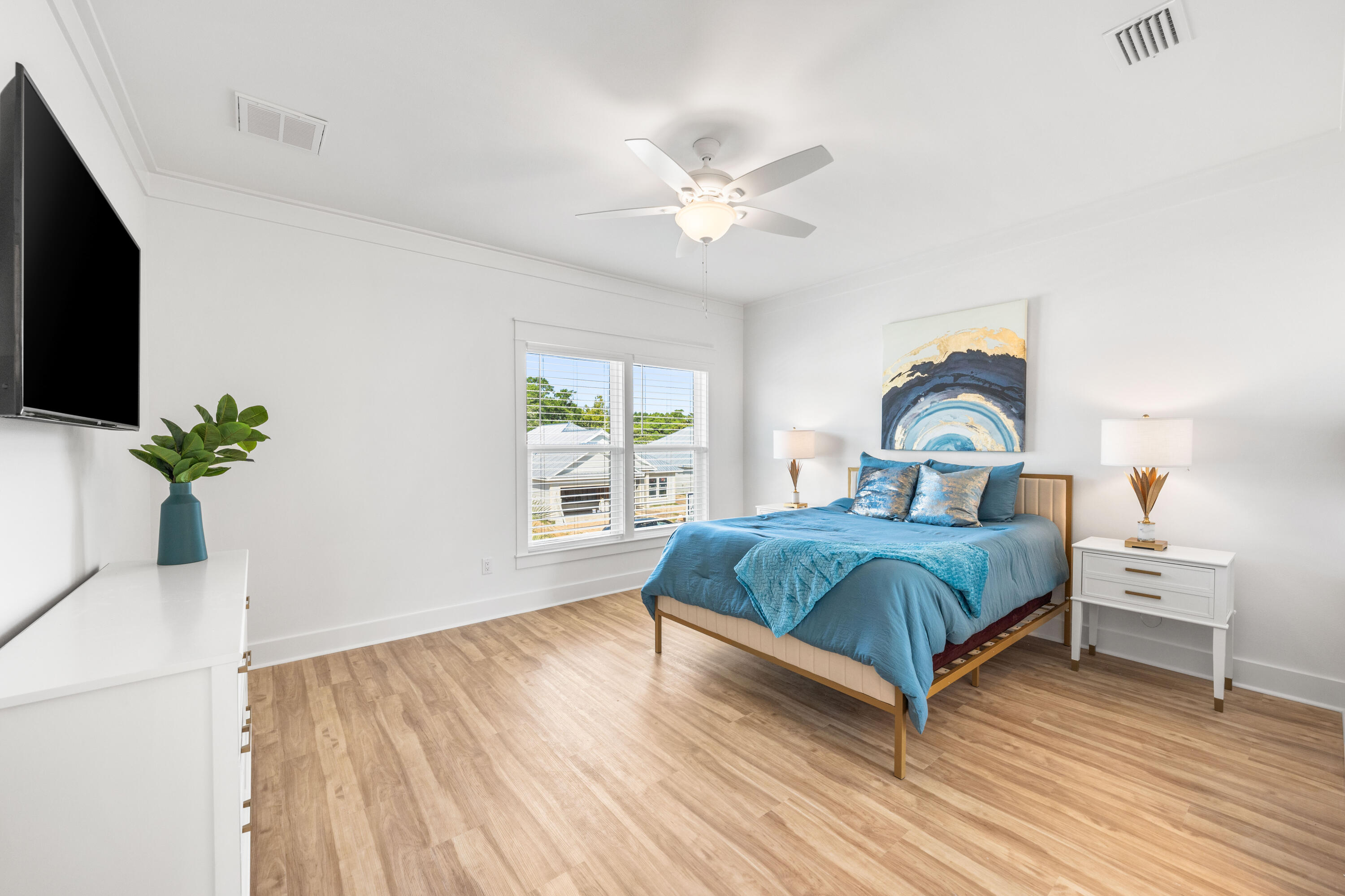 104 Fletcher Way Destin, FL 32541 - Photo 24 of 59 a bedroom with a bed and a window