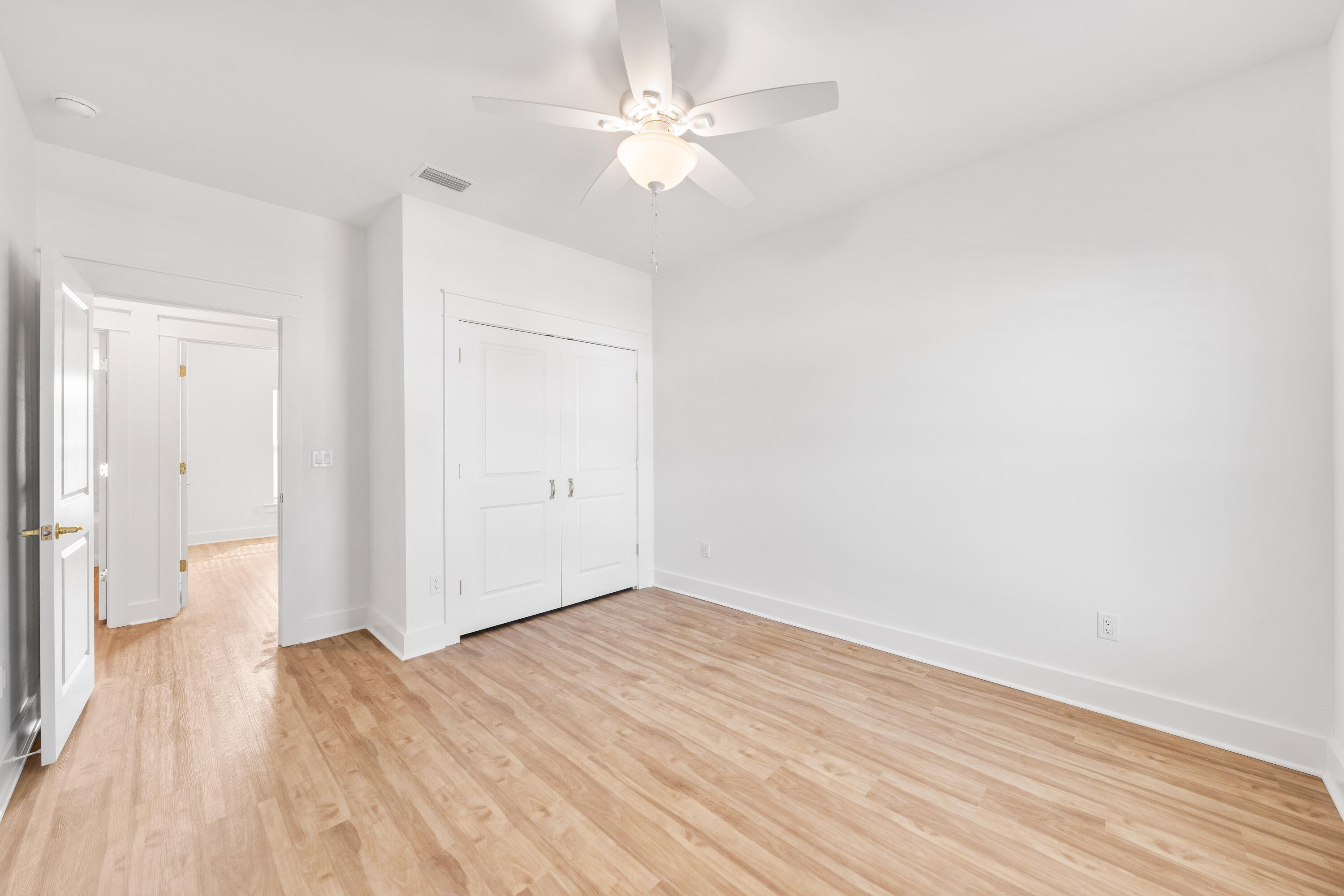 104 Fletcher Way Destin, FL 32541 - Photo 35 of 59 wooden floor in an empty room with a window