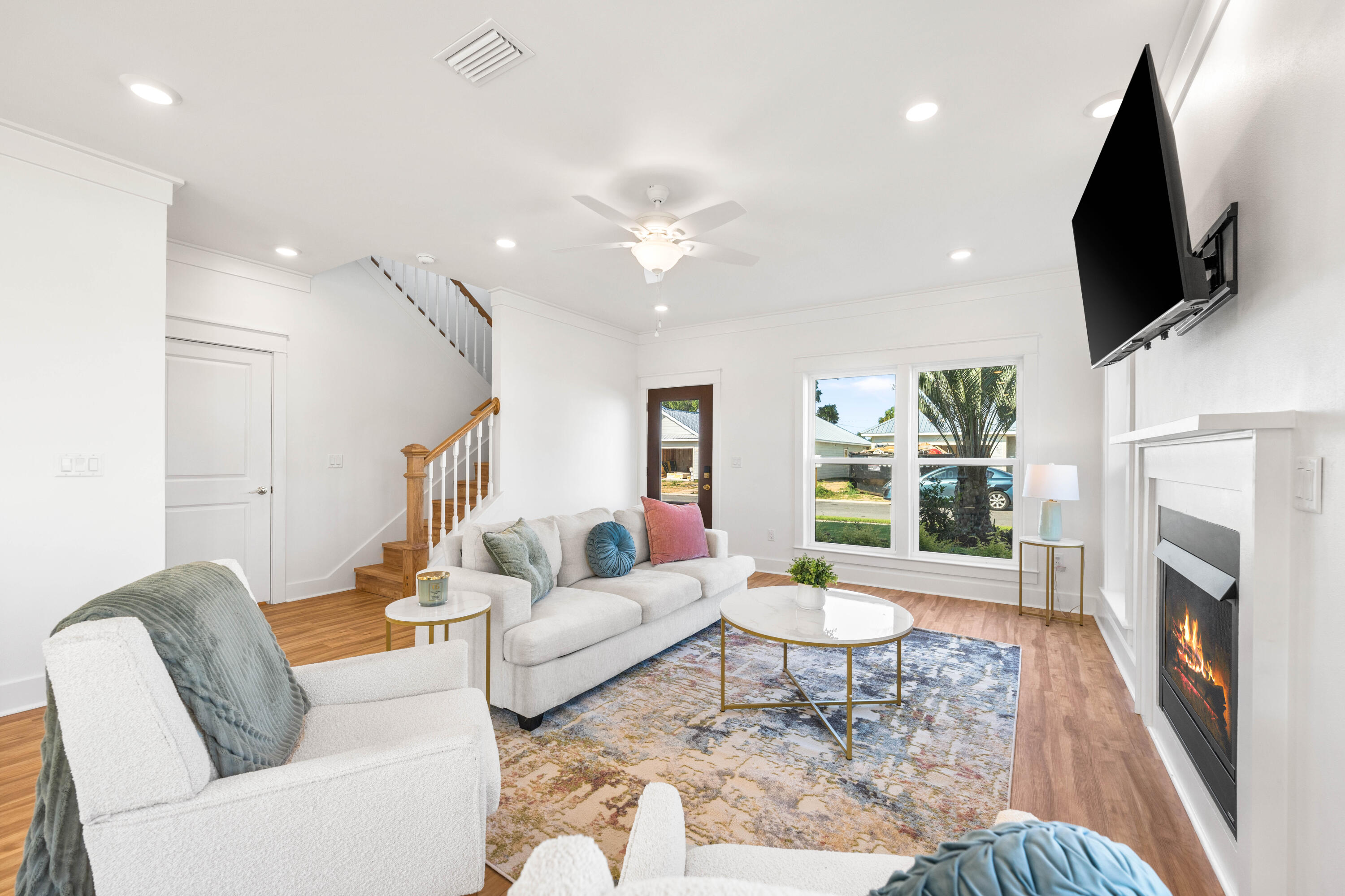 104 Fletcher Way Destin, FL 32541 - Photo 5 of 59 a living room with fireplace furniture and a flat screen tv