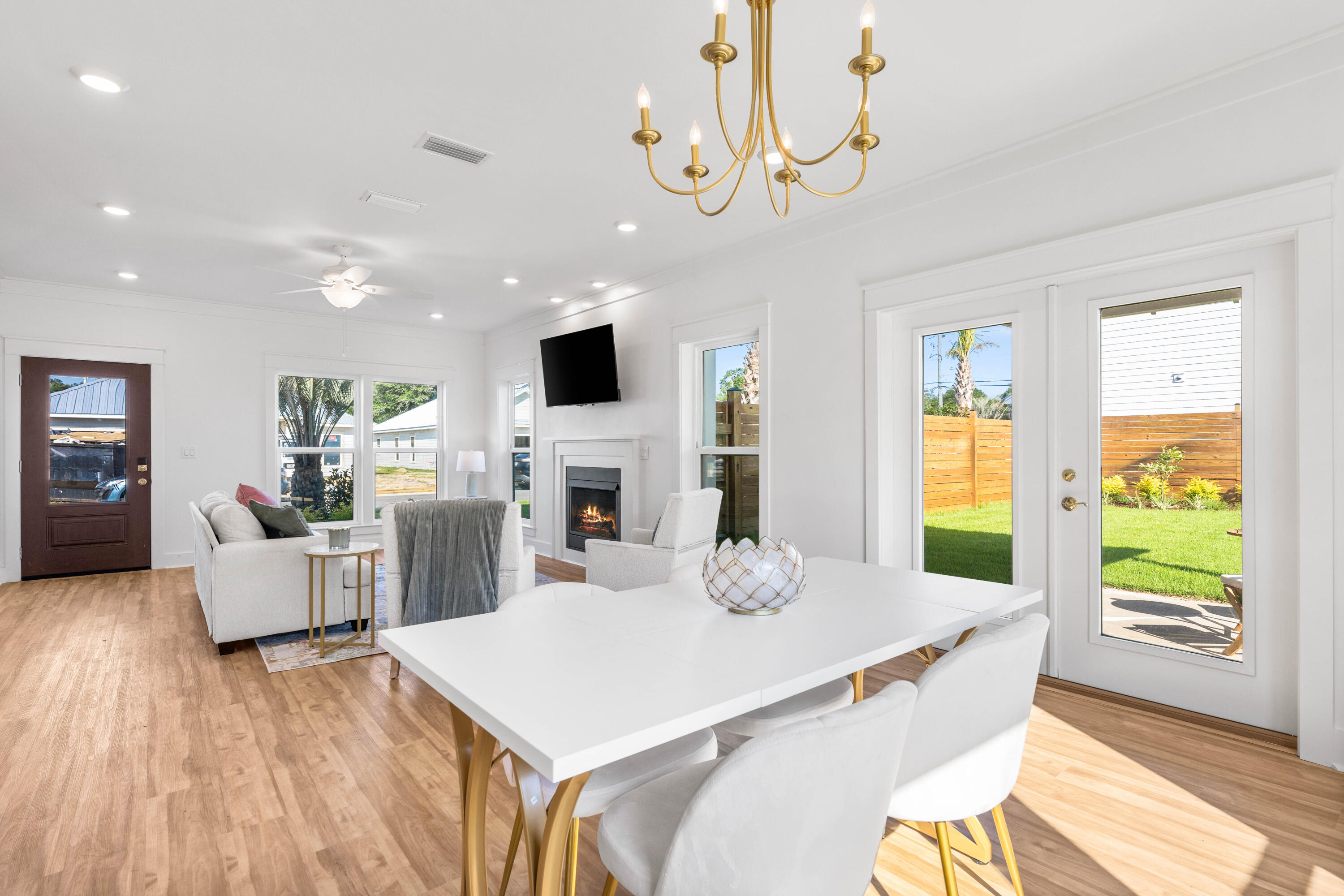 104 Fletcher Way Destin, FL 32541 - Photo 10 of 59 a view of a dining room with furniture window and wooden floor