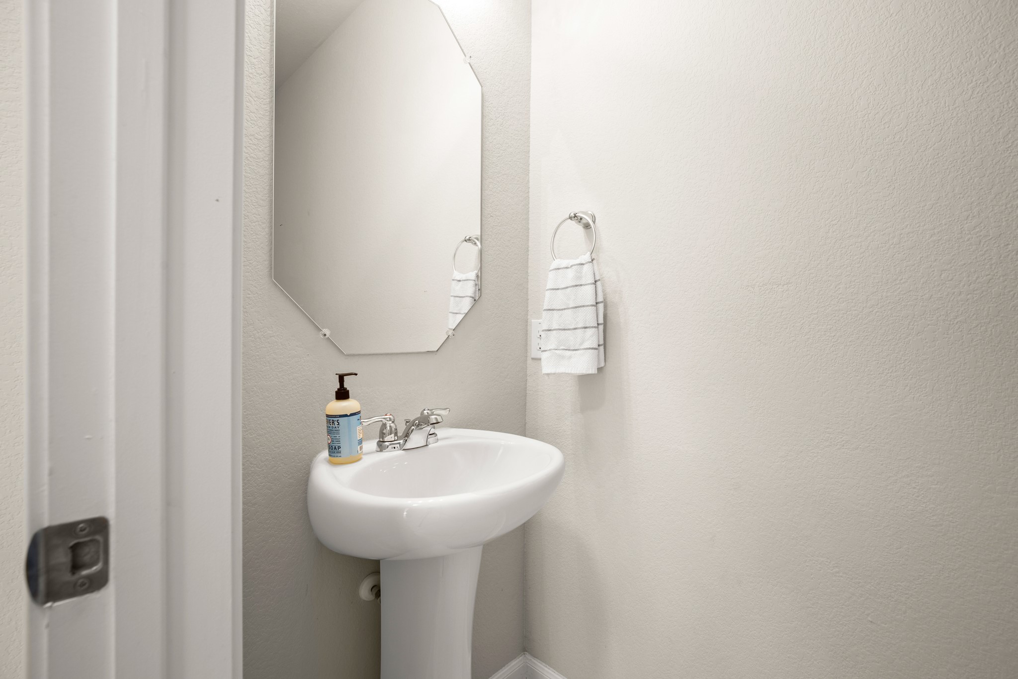 6520 Ranchito Drive Austin, TX 78744 - Photo 11 of 40 a bathroom with a sink and a mirror
