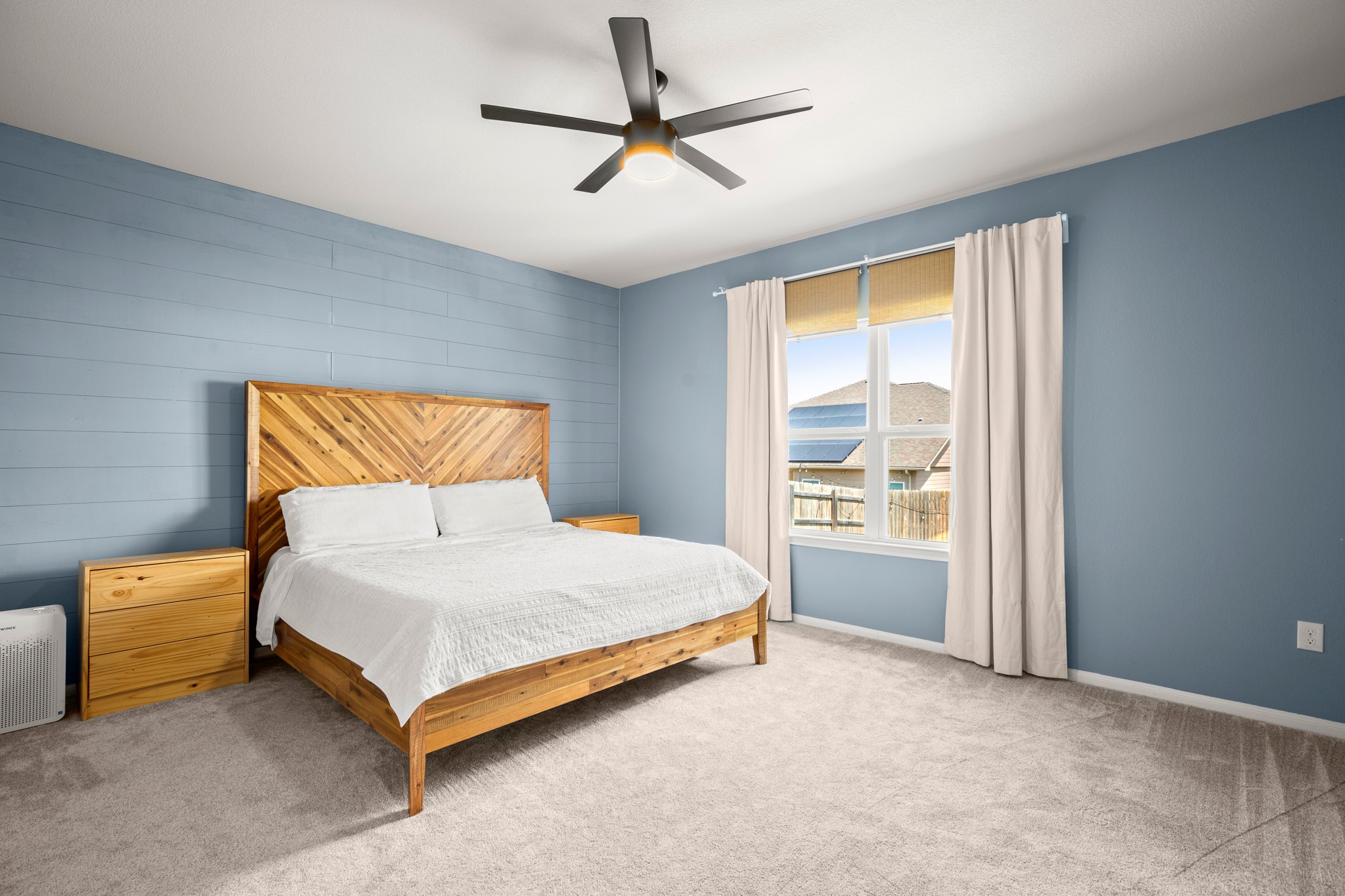 6520 Ranchito Drive Austin, TX 78744 - Photo 12 of 40 a bedroom with a bed and a ceiling fan