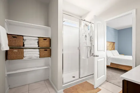 a bathroom with a sink a vanity a mirror and shower