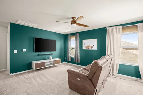 a living room with furniture and a window
