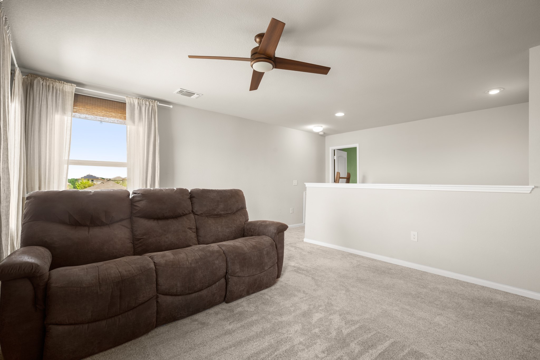 6520 Ranchito Drive Austin, TX 78744 - Photo 24 of 40 a living room with furniture and a window