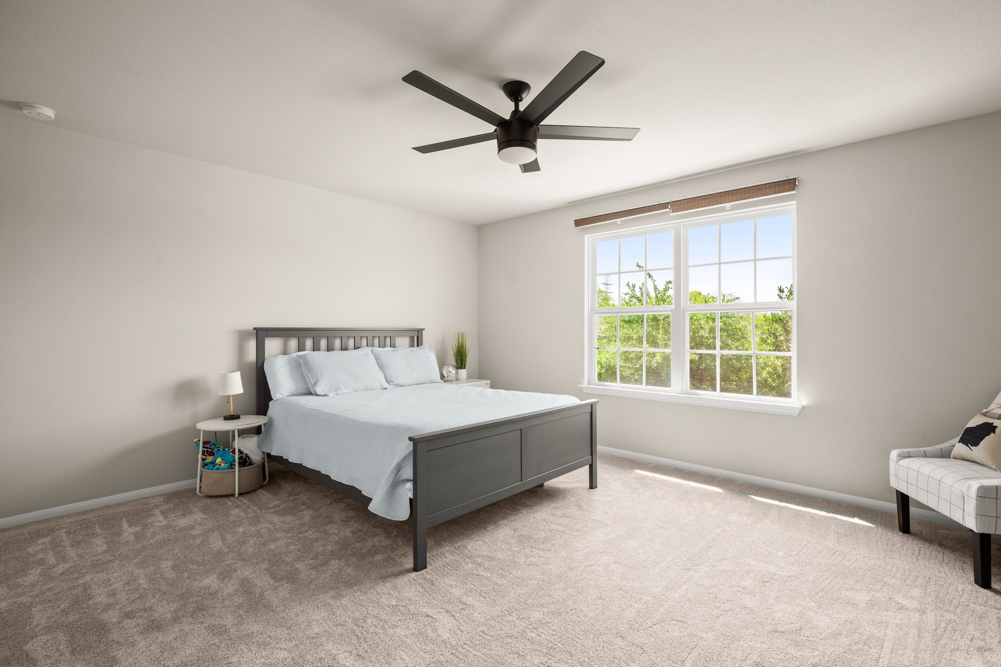 6520 Ranchito Drive Austin, TX 78744 - Photo 26 of 40 a white bed sitting in a bedroom next to a window