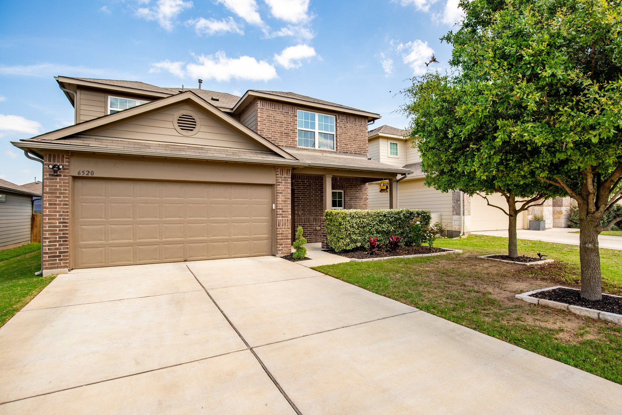 6520 Ranchito Drive Austin, TX 78744 - Photo 34 of 40 a front view of a house with garden