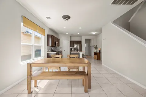 a view of kitchen with cabinets