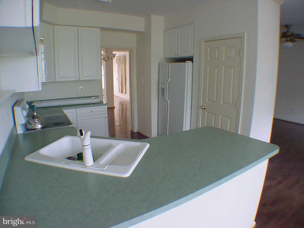 2430 Rippling Brook Road Frederick, MD 21701 - Photo 12 of 30 a kitchen with a sink and cabinets
