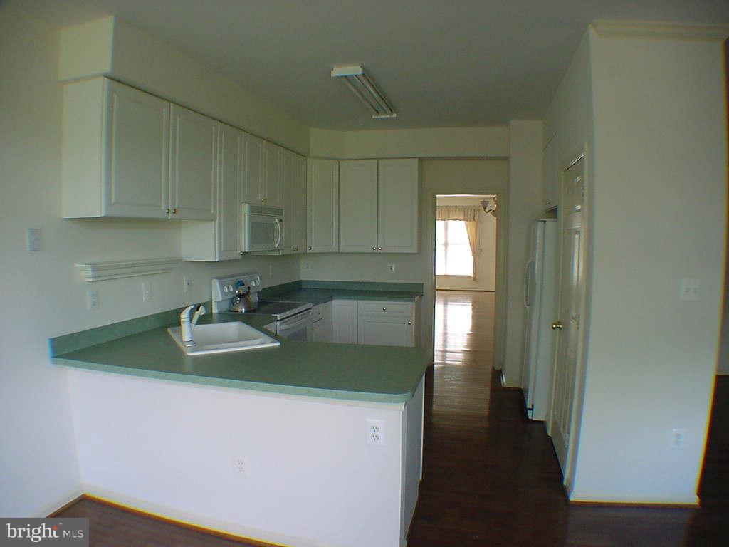 2430 Rippling Brook Road Frederick, MD 21701 - Photo 13 of 30 a kitchen with sink a refrigerator and washer