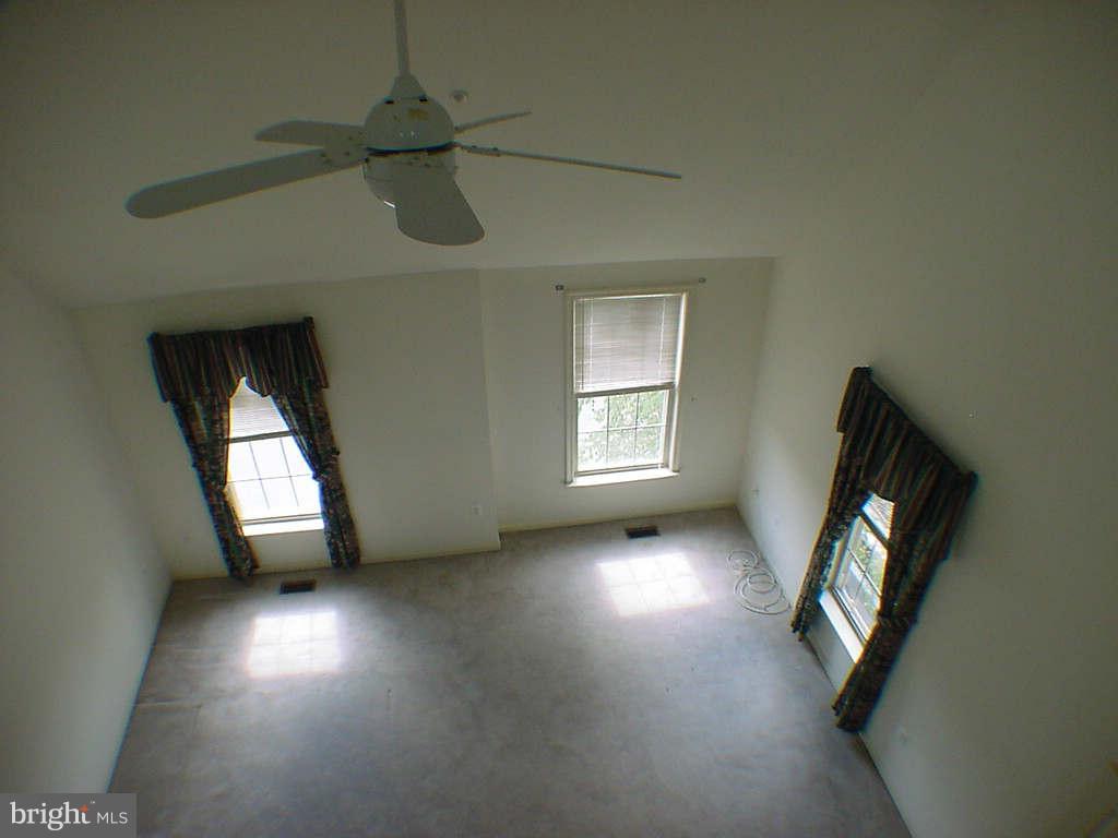 2430 Rippling Brook Road Frederick, MD 21701 - Photo 15 of 30 an empty room with windows and cabinet