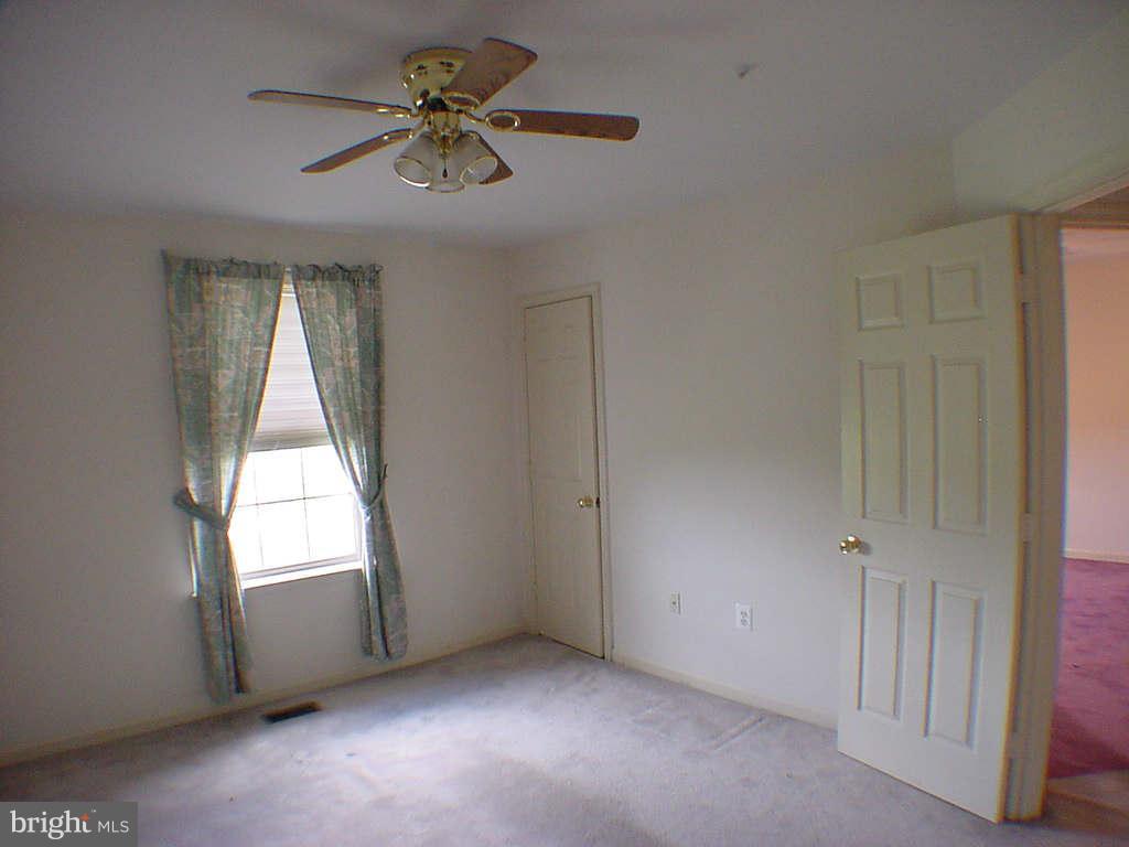 2430 Rippling Brook Road Frederick, MD 21701 - Photo 20 of 30 an empty room with windows and fan