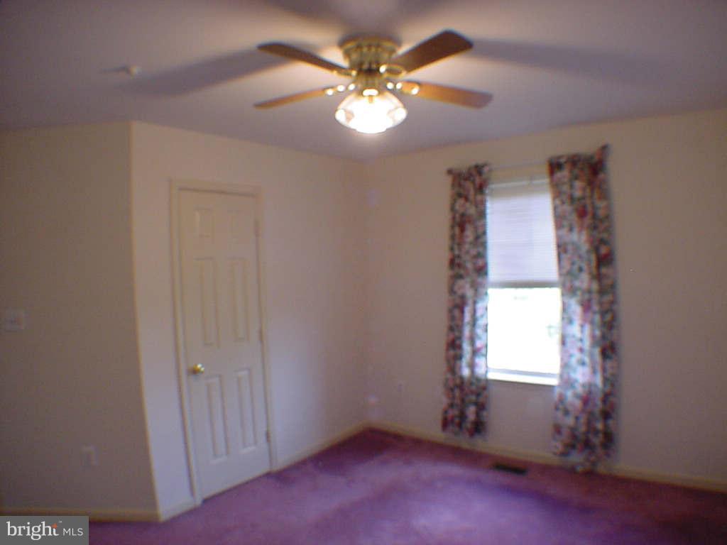 2430 Rippling Brook Road Frederick, MD 21701 - Photo 21 of 30 an empty room with windows and fan