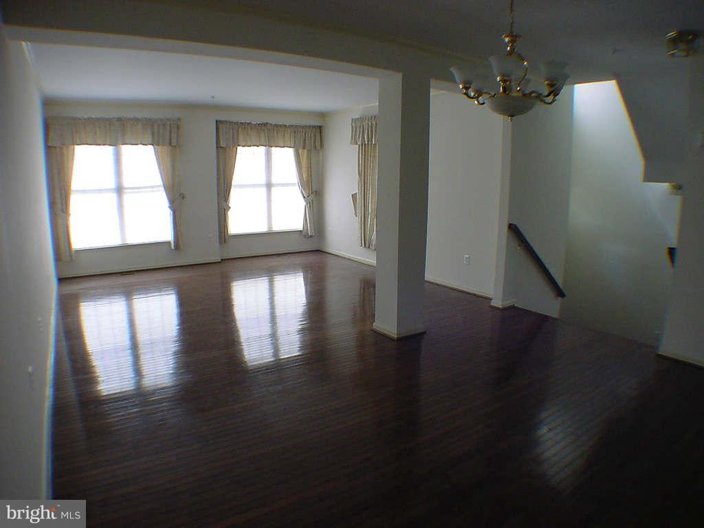 2430 Rippling Brook Road Frederick, MD 21701 - Photo 8 of 30 a view of empty room with wooden floor and fan