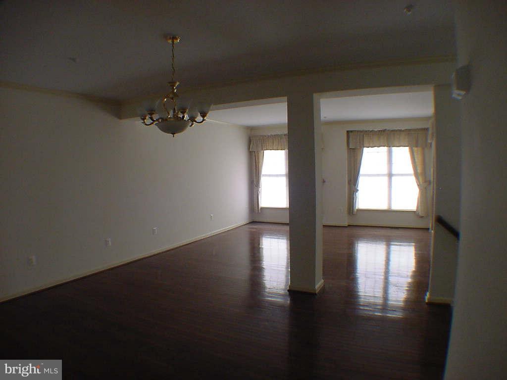 2430 Rippling Brook Road Frederick, MD 21701 - Photo 10 of 30 a view of empty room with wooden floor and fan