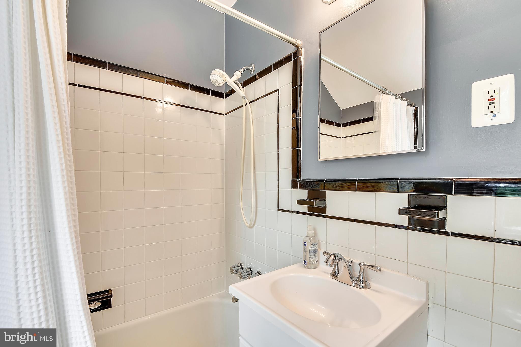 9310 Glenville Road Silver Spring, MD 20901 - Photo 19 of 30 The upstairs full bath has classic B/W detailing