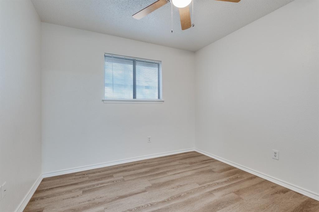 2308 West Oakdale Road Irving, TX 75060 - Photo 7 of 12 an empty room with a window