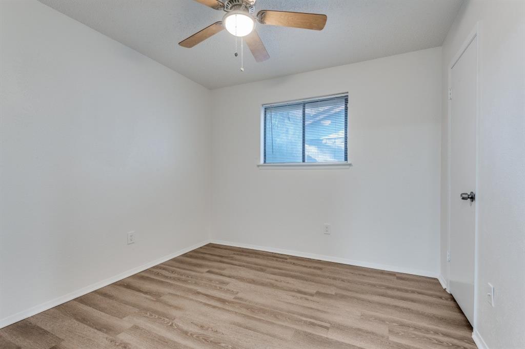 2308 West Oakdale Road Irving, TX 75060 - Photo 8 of 12 a view of empty room with wooden floor