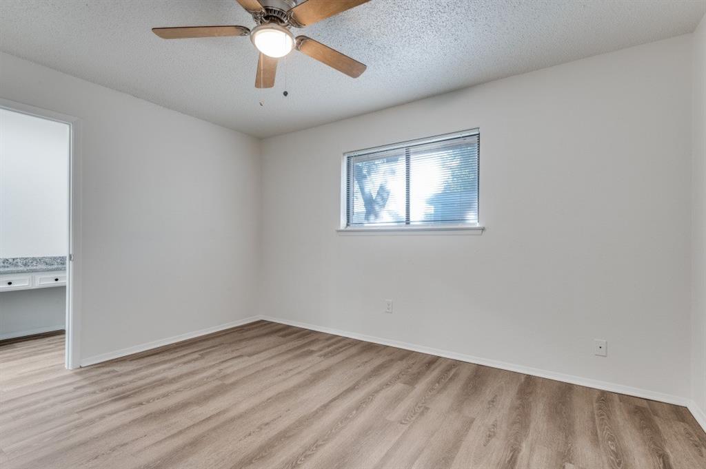 2308 West Oakdale Road Irving, TX 75060 - Photo 9 of 12 wooden floor in an empty room with a window