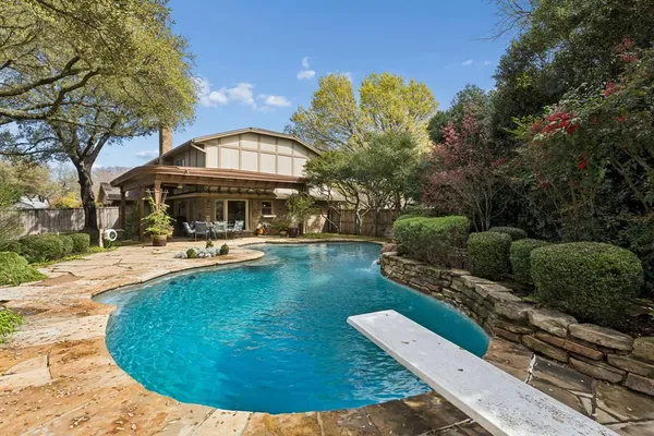 a view of a swimming pool with a patio
