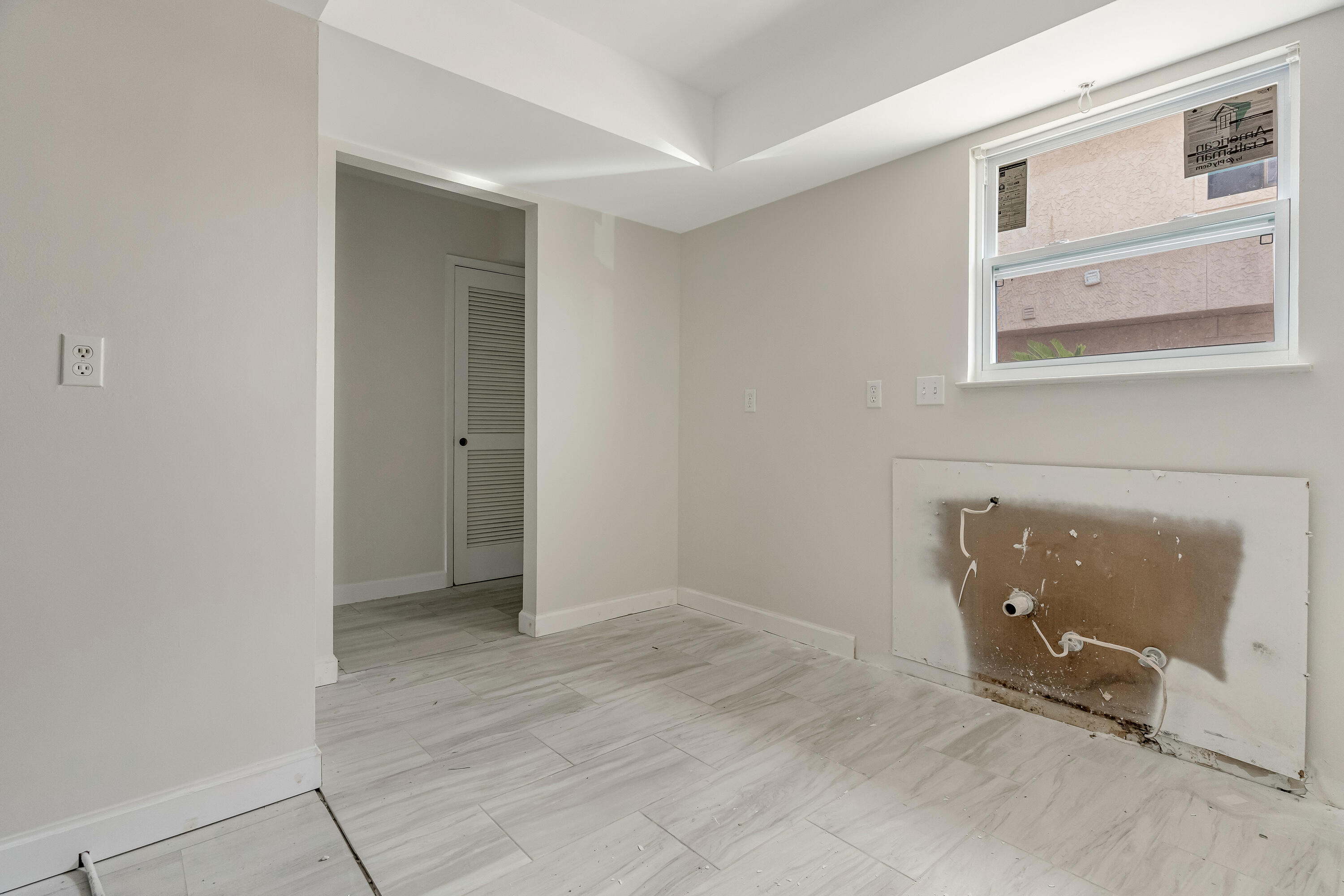 113 Cedar Avenue Southwest, Unit A Fort Walton Beach, FL 32548 - Photo 2 of 32 a view of an empty room with wooden floor and a window