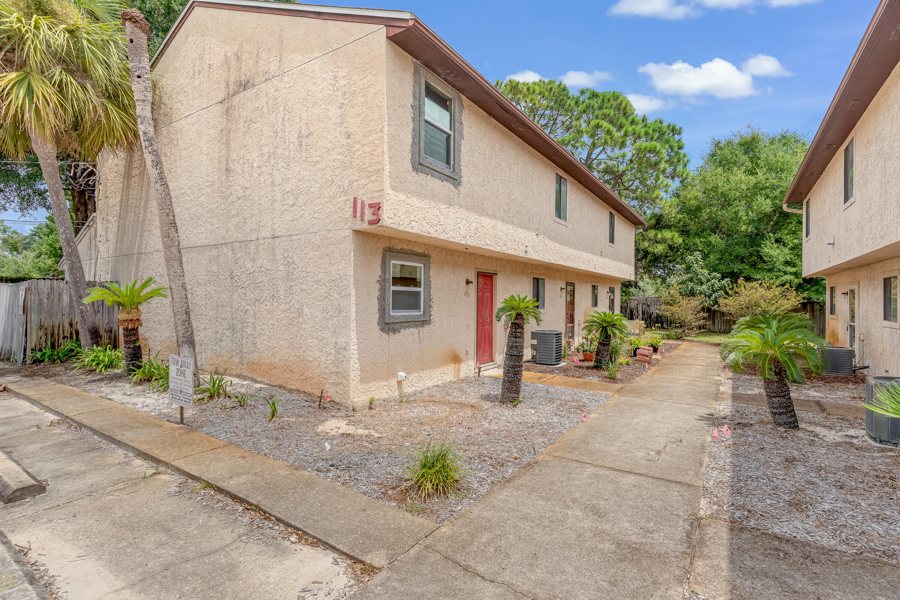 113 Cedar Avenue Southwest, Unit A Fort Walton Beach, FL 32548 - Photo 25 of 32 a view of a house with backyard and plants