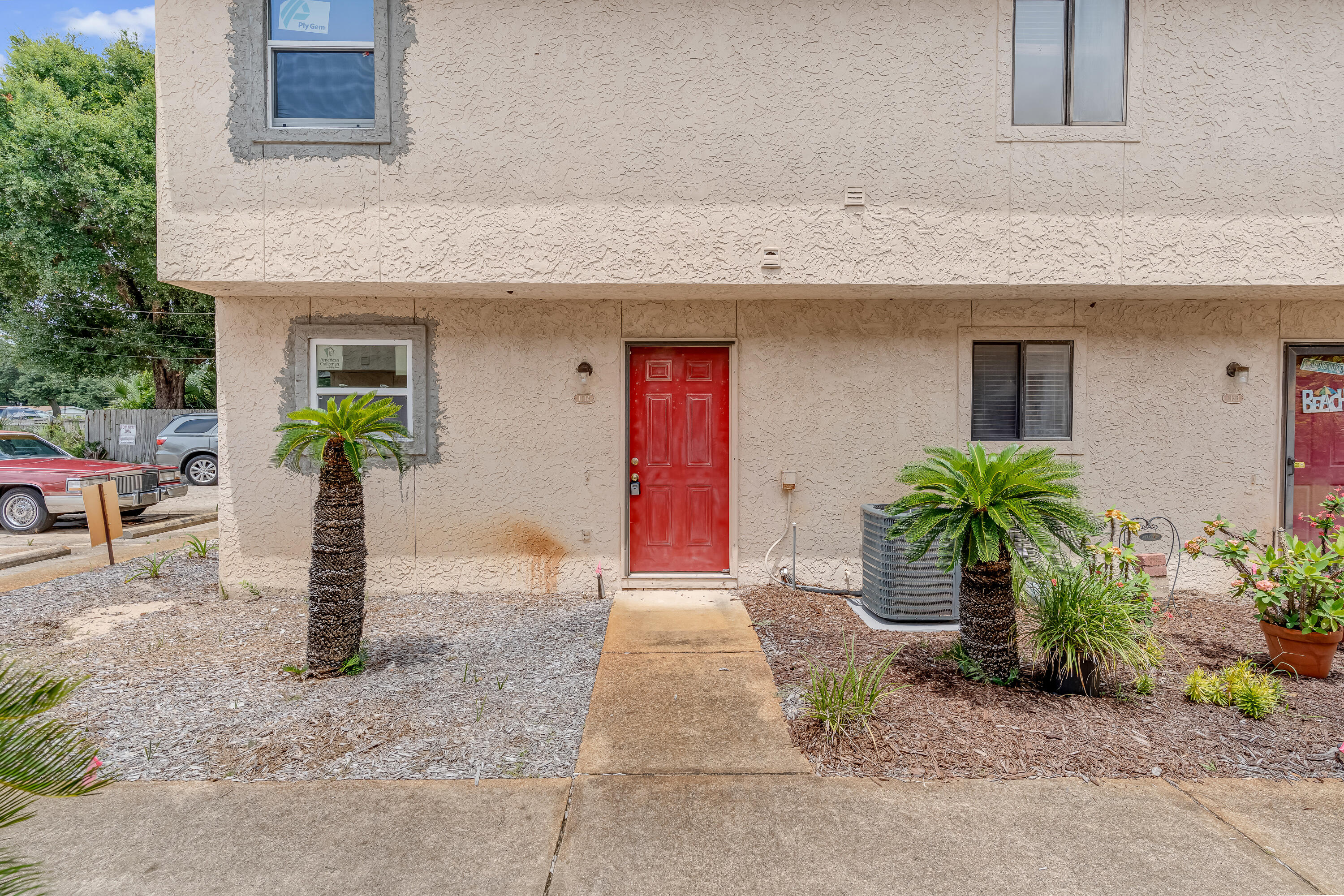 113 Cedar Avenue Southwest, Unit A Fort Walton Beach, FL 32548 - Photo 27 of 32 a front view of a house with garden