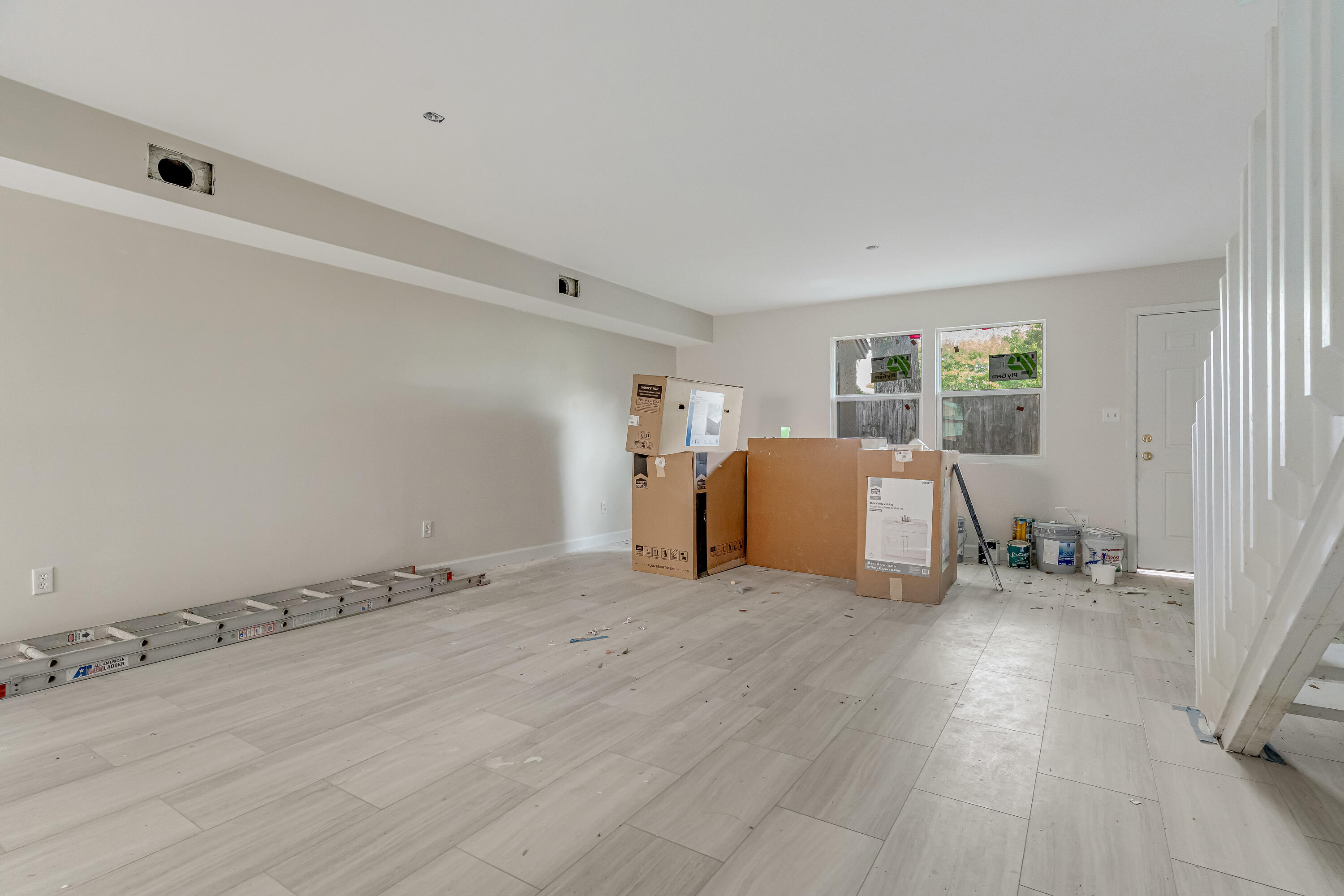113 Cedar Avenue Southwest, Unit A Fort Walton Beach, FL 32548 - Photo 6 of 32 a view of an empty room with a window and wooden floor