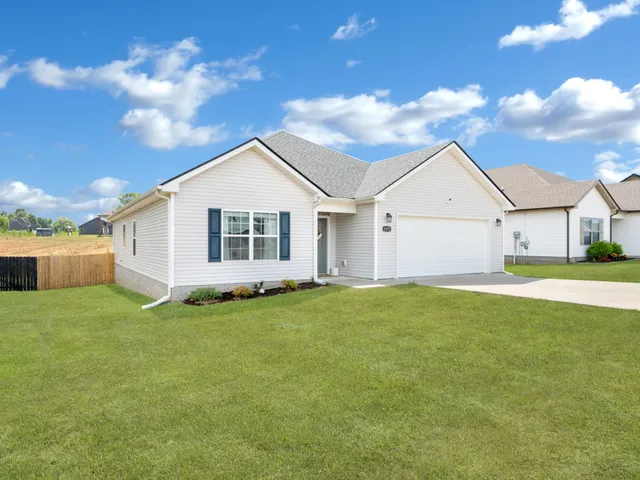 a view of a backyard of the house