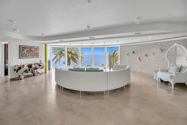 a large white bed in a white room