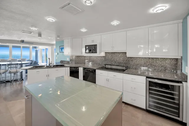 a view of a kitchen with washer and dryer