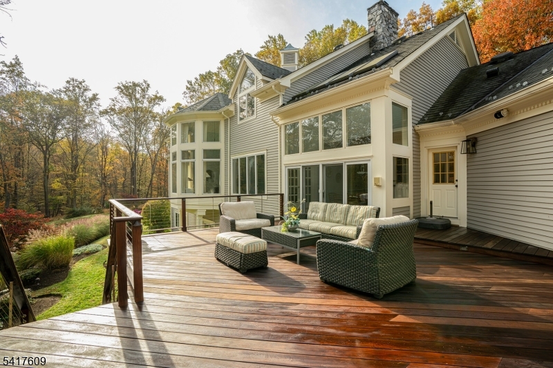 2 Cobblefield Road Mendham, NJ 07945 - Photo 43 of 50 a view of a patio with couches chairs and wooden floor