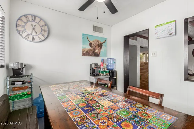 a bedroom with a bed and a table in it