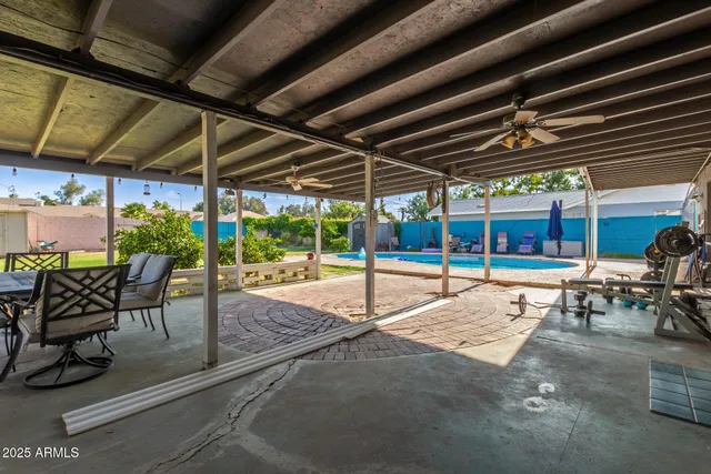 a view of a chairs and table in patio