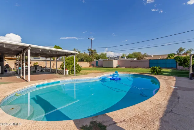 a view of a swimming pool with a patio