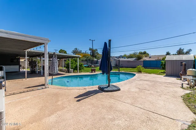 a view of a park with potted plants