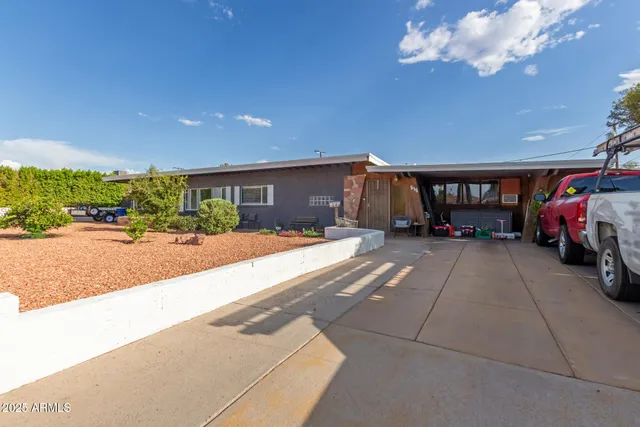 a lobby with furniture and a potted plant