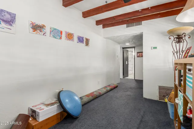 a room with furniture and a view of living room