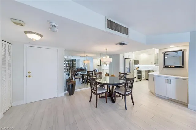 a dining area with furniture and window