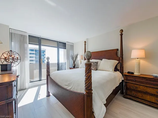 a bedroom with bed and a window