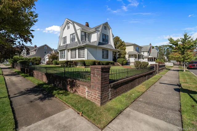 a view of multiple houses with a yard