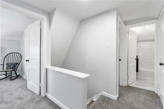 a bedroom with bed and chair