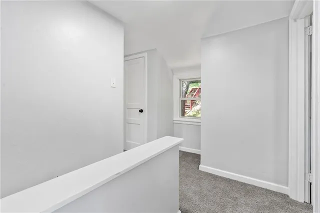 a bedroom with a bed and lamp