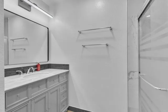 a bathroom with a sink and a mirror