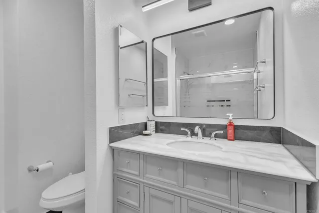 a bathroom with a shower and toilet