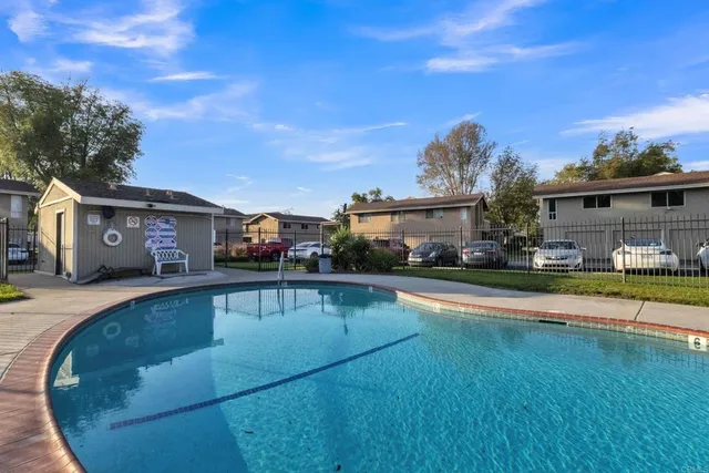 a view of a house with swimming pool yard and patio