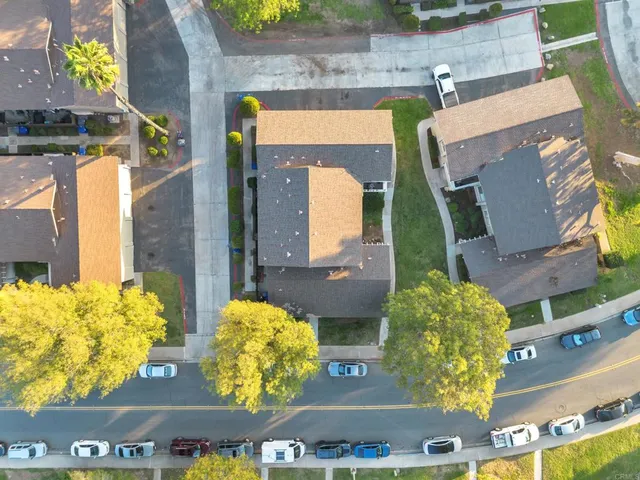 an aerial view of residential houses with outdoor space