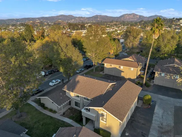 an aerial view of a house with garden space lake view and mountain view