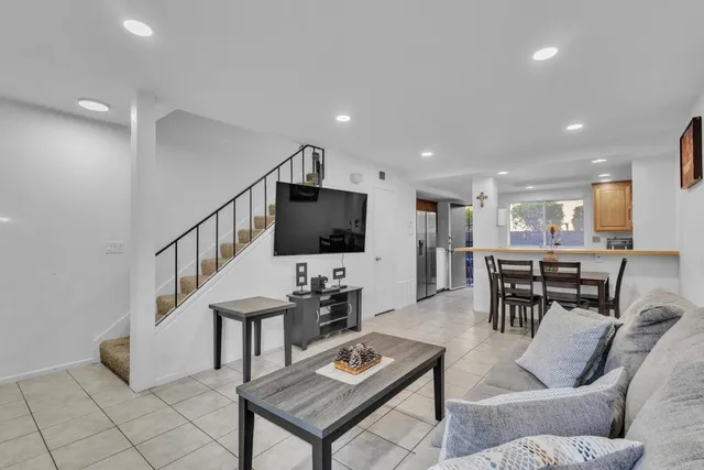 a kitchen with stainless steel appliances a stove sink microwave and cabinets
